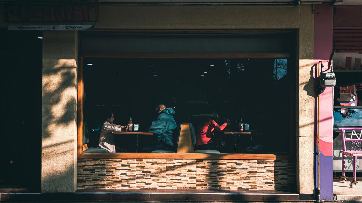 People dining inside a Mexico City restaurant, illustrating the global Pay What You Can Day initiative in 2026.