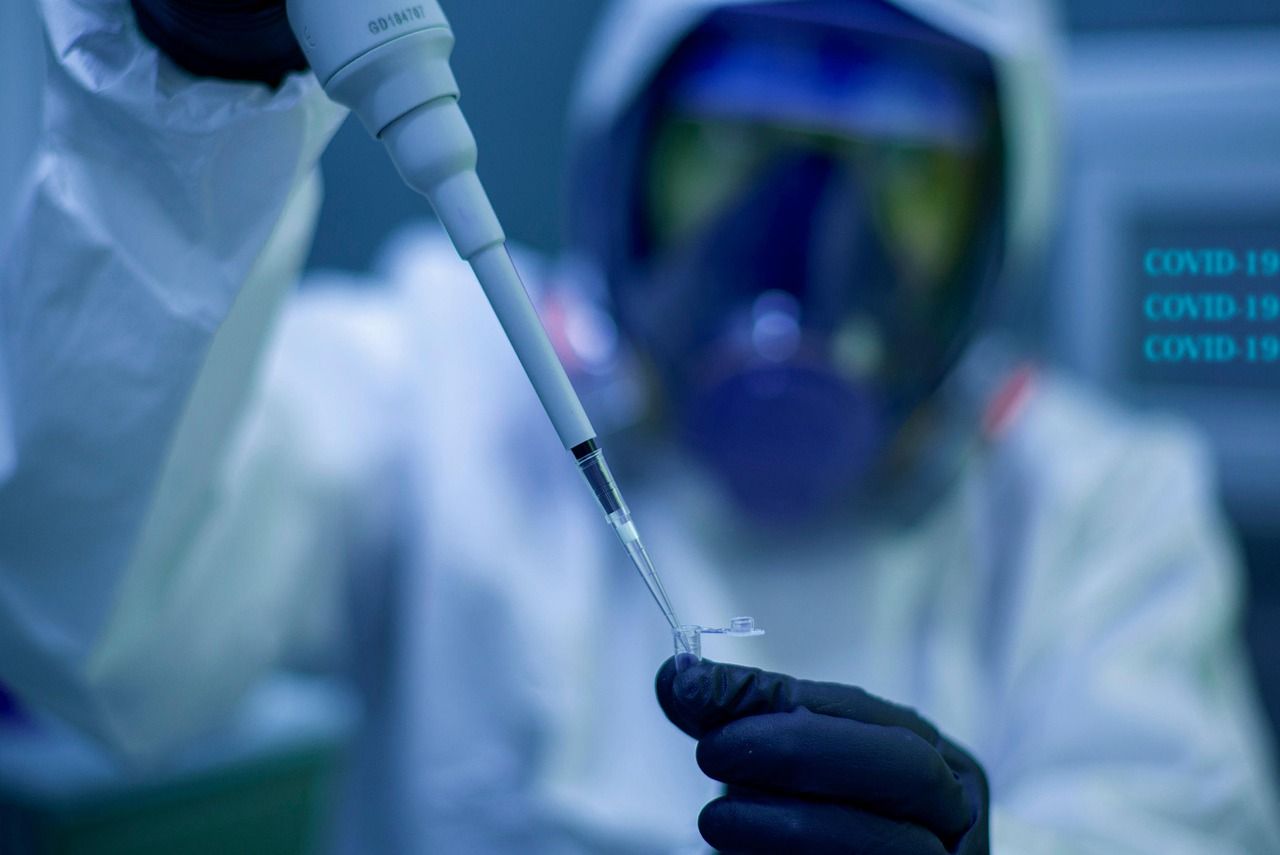 Scientist handling laboratory samples during biomedical research