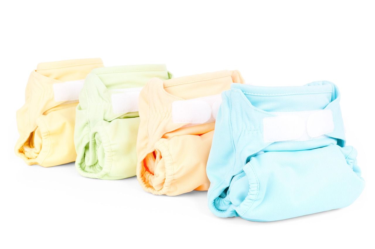 Folded cloth diaper against a plain background