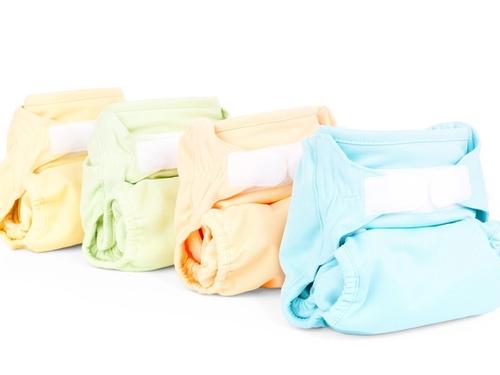 Folded cloth diaper against a plain background