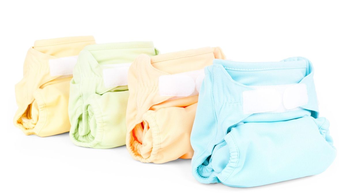 Folded cloth diaper against a plain background