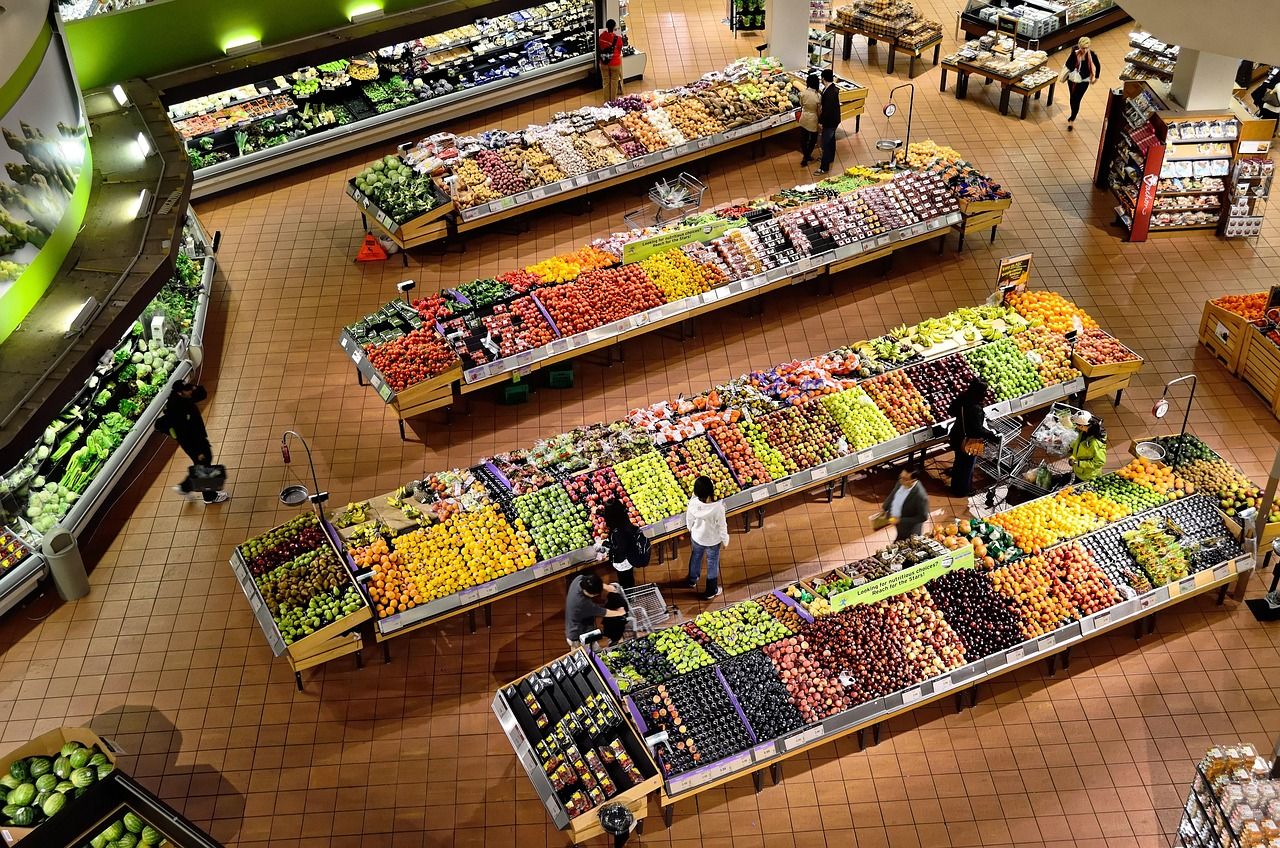 Market stall stocked with fresh vegetables and fruit