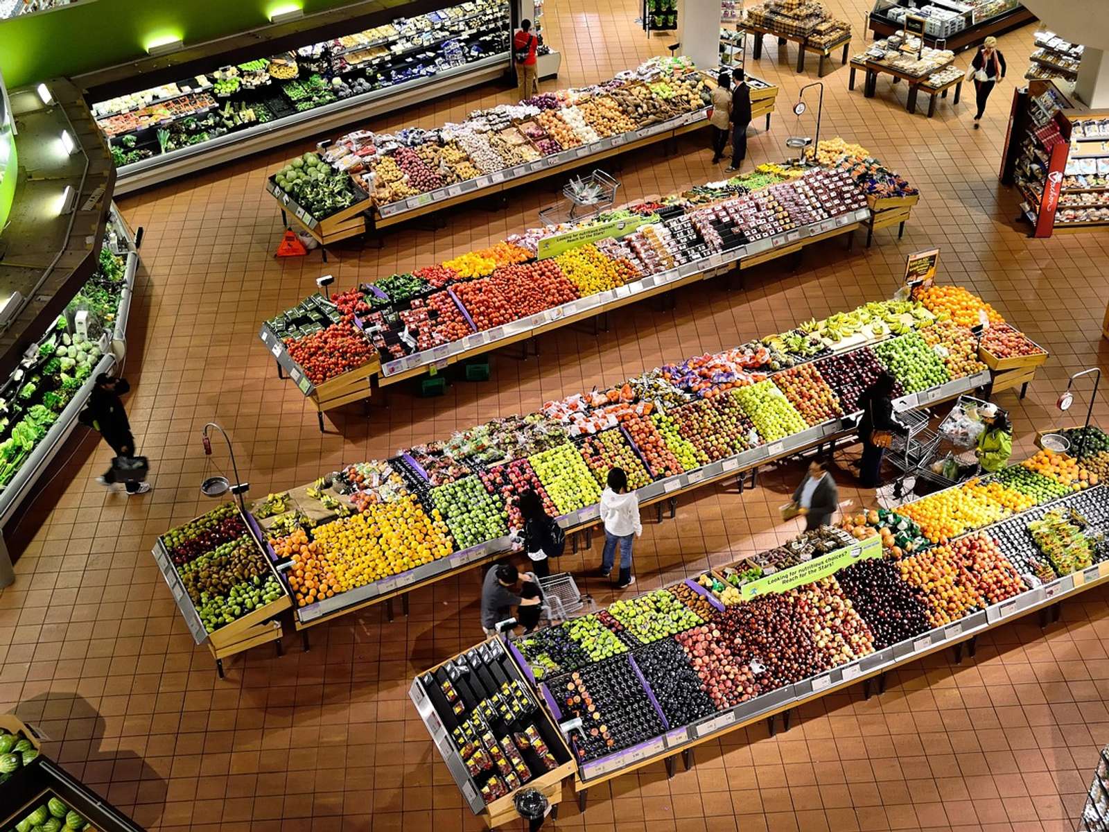 Market stall stocked with fresh vegetables and fruit