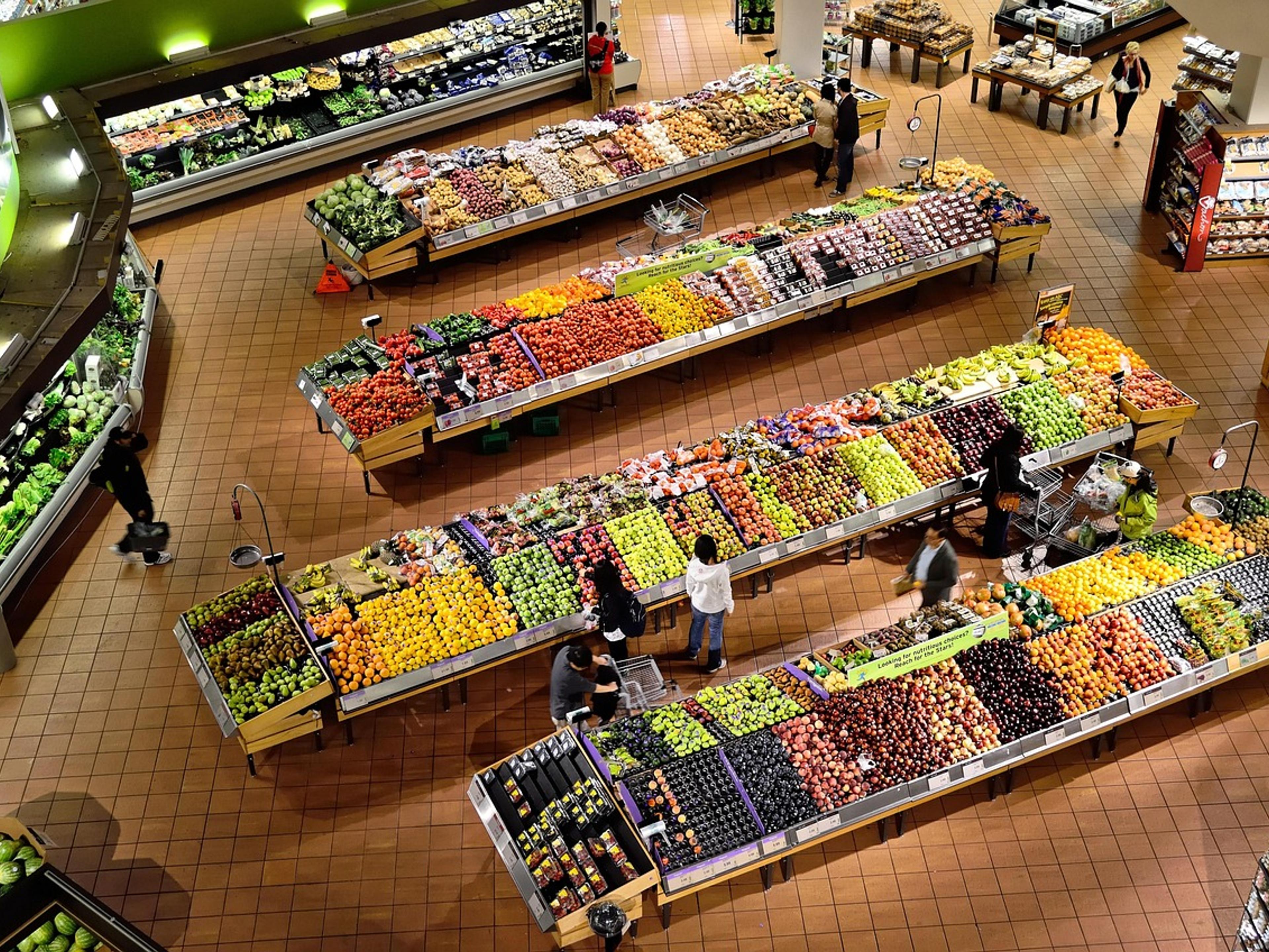 Market stall stocked with fresh vegetables and fruit