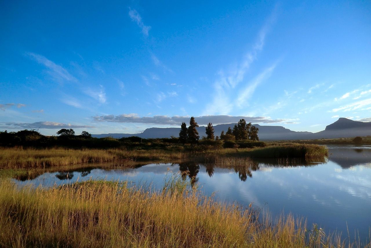 Rocky mountains and green slopes in the Drakensberg range in South Africa