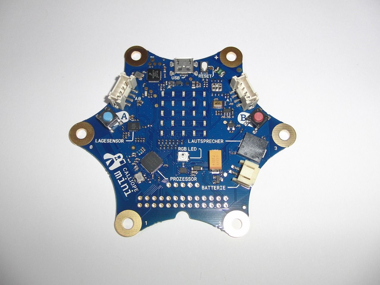 A blue hexagonal circuit board with small electronic components on a white background