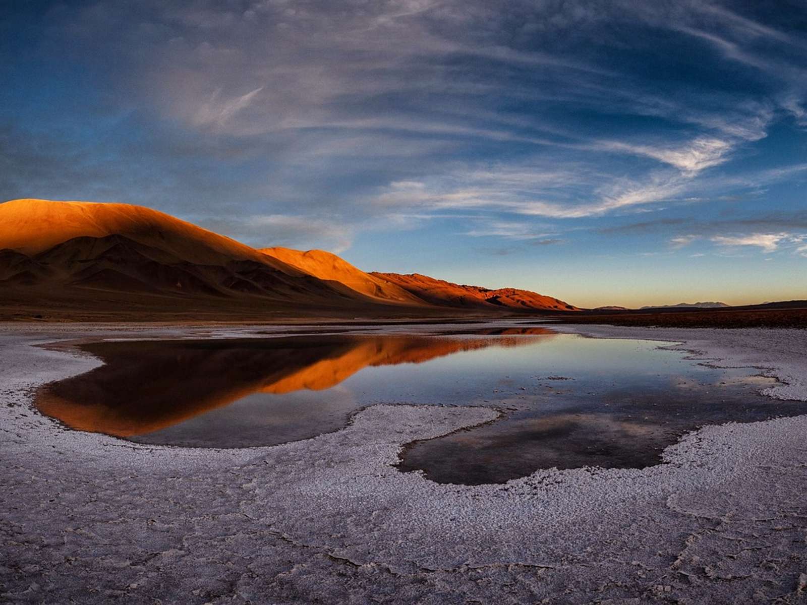 A salt flat and Andes mountains in the Atacama region