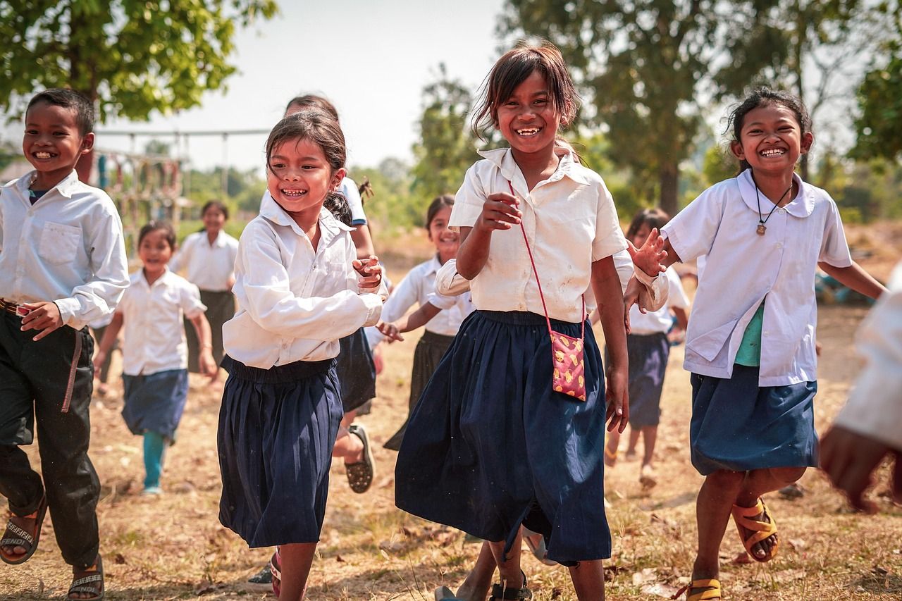 Children standing outdoors in the Cambodian countryside