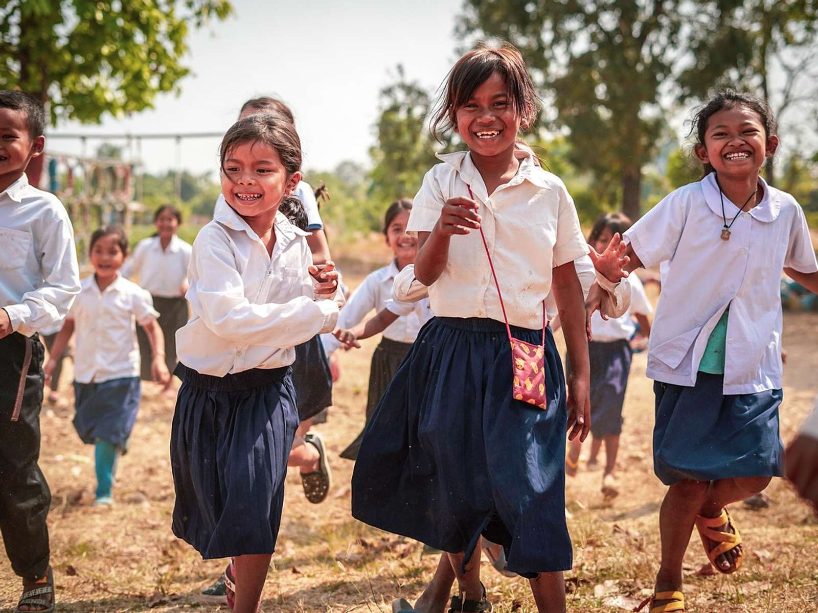 Children standing outdoors in the Cambodian countryside