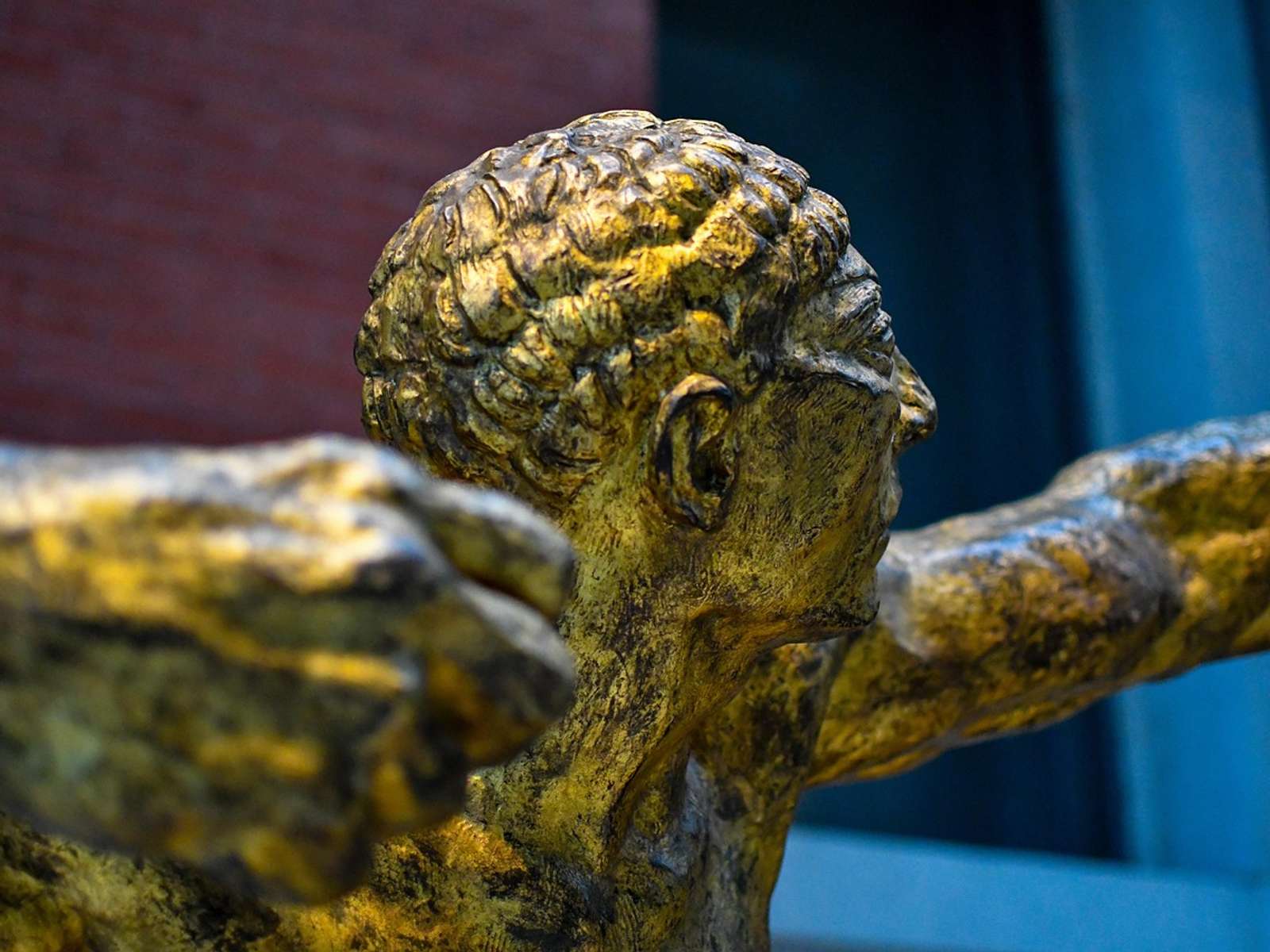 Ancient Greek bronze statue displayed in a museum