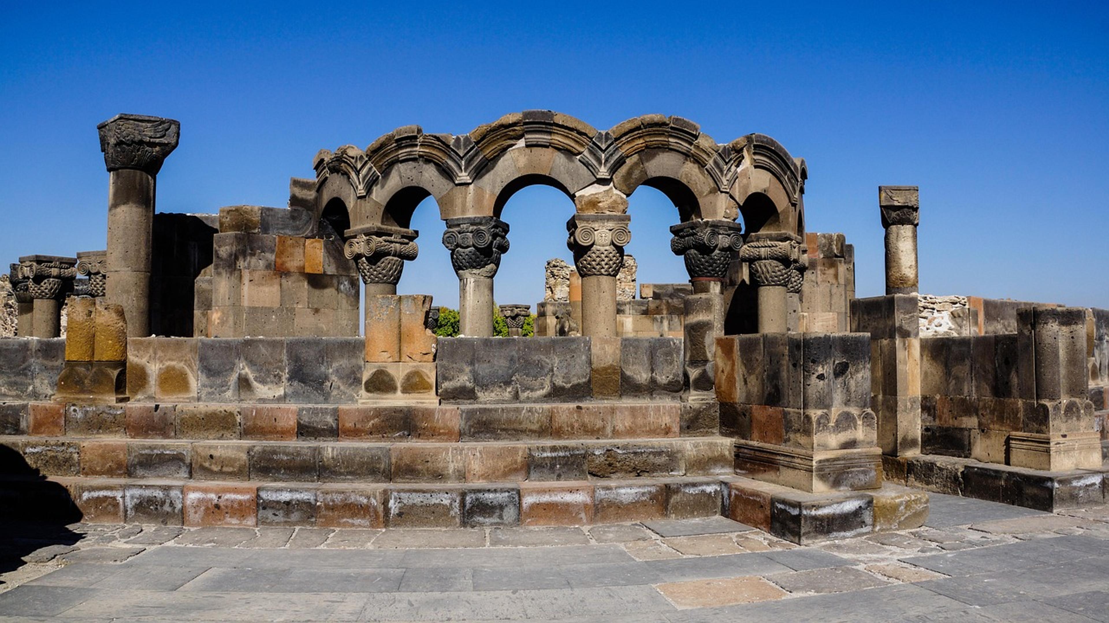 Ruined stone columns and arches of an ancient church