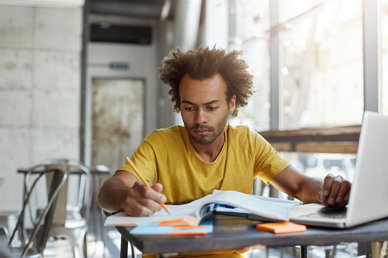 A student writing in a notebook