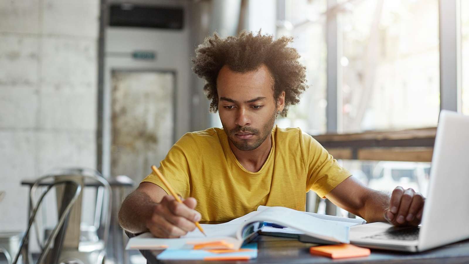 A student writing in a notebook