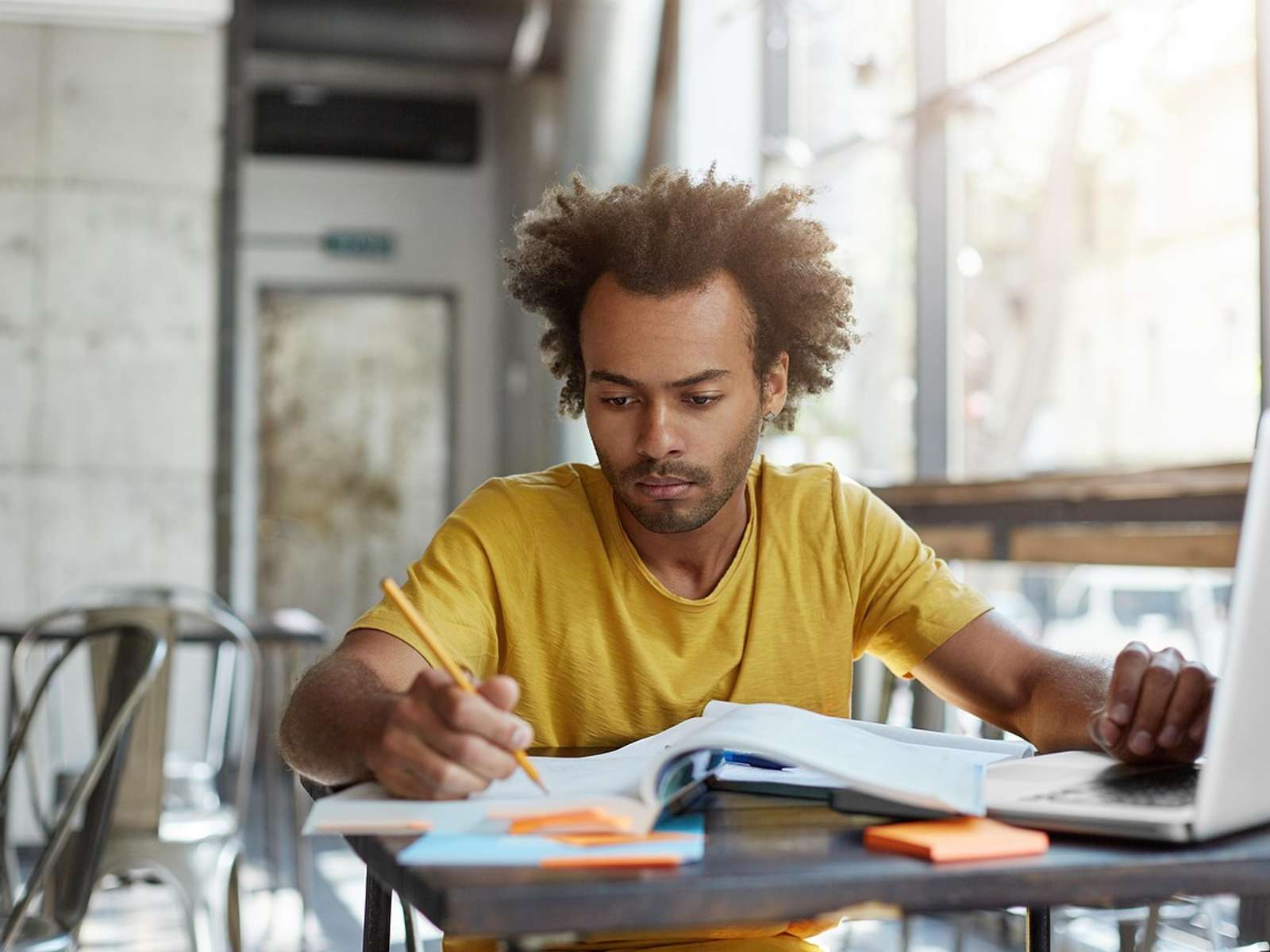 A student writing in a notebook