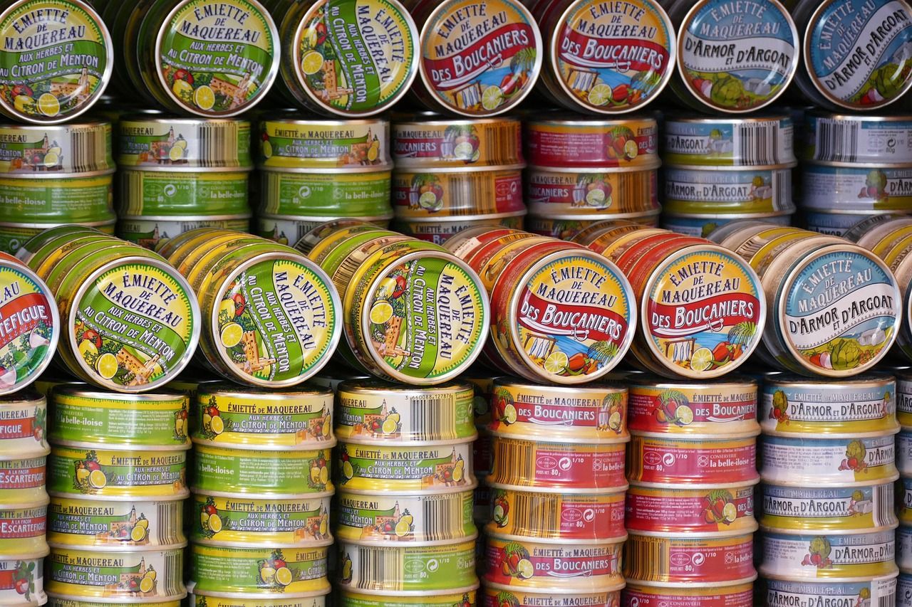 Shelf stocked with canned food donations