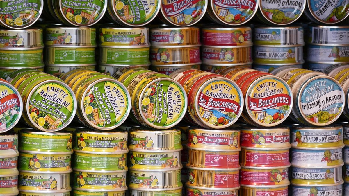 Shelf stocked with canned food donations