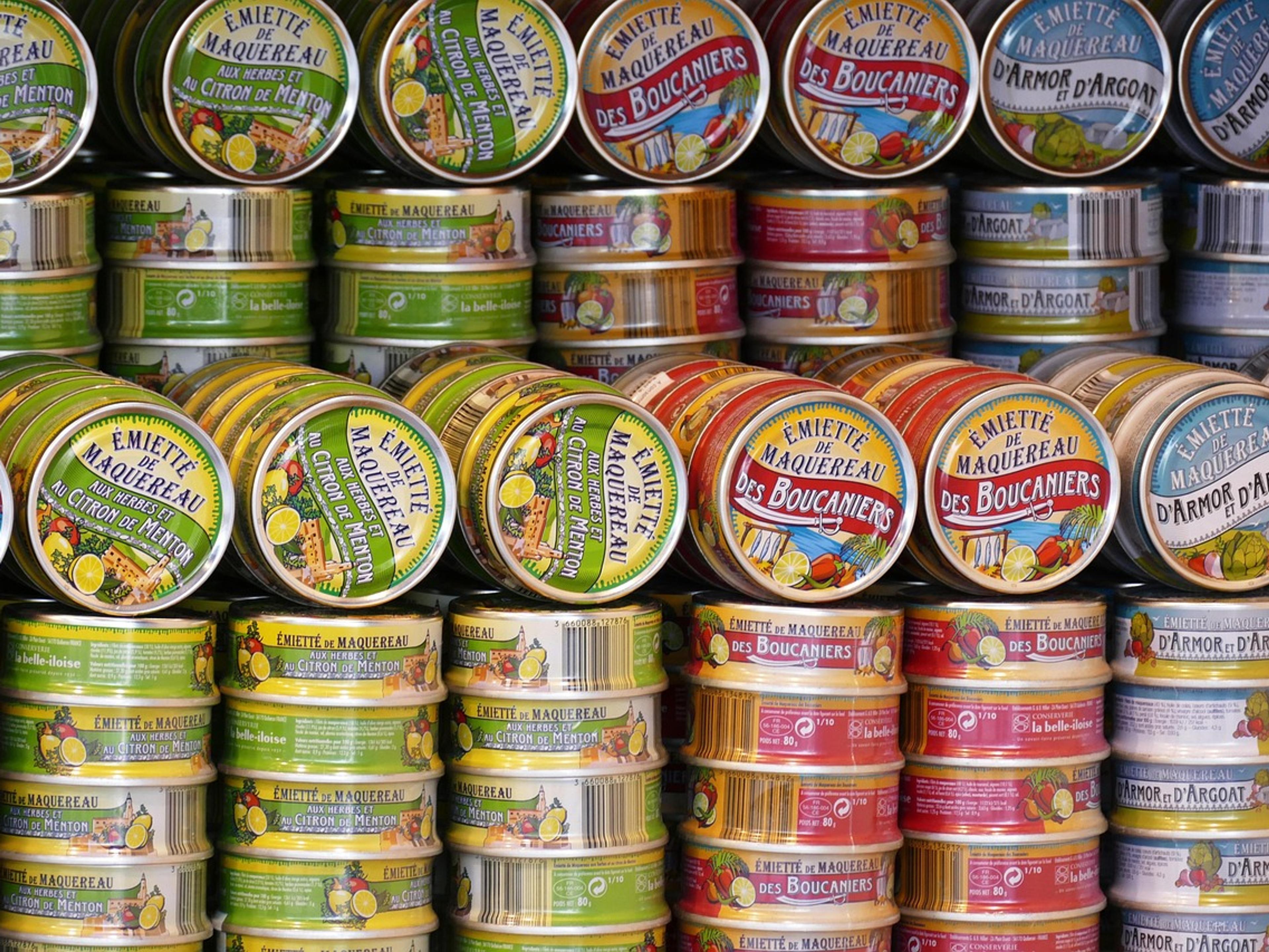 Shelf stocked with canned food donations
