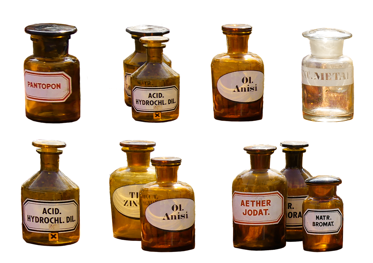 Small brown medicine bottles on a white background