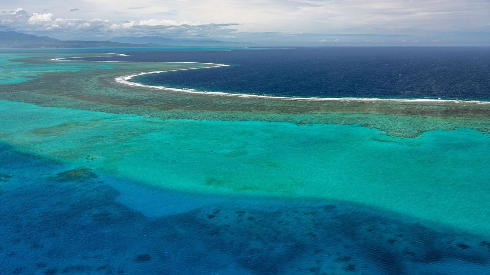 An atoll lagoon ringed by coral reef