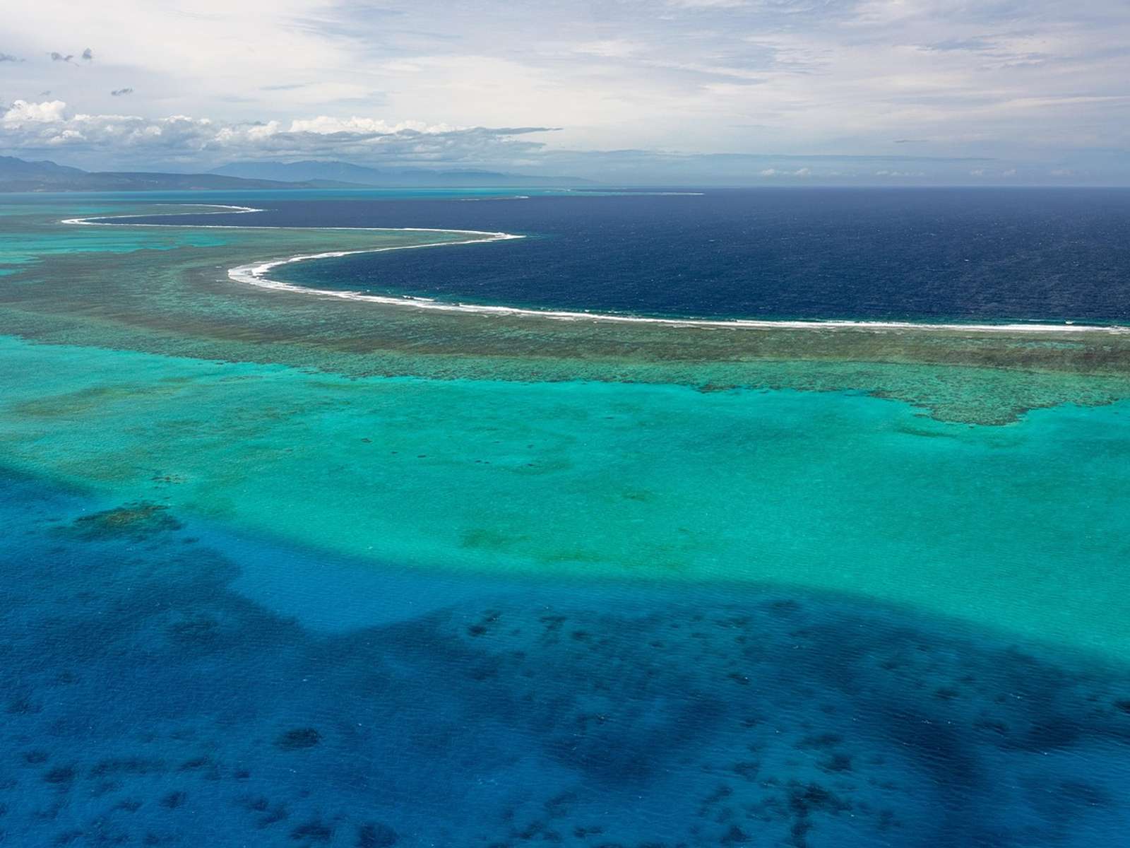 An atoll lagoon ringed by coral reef