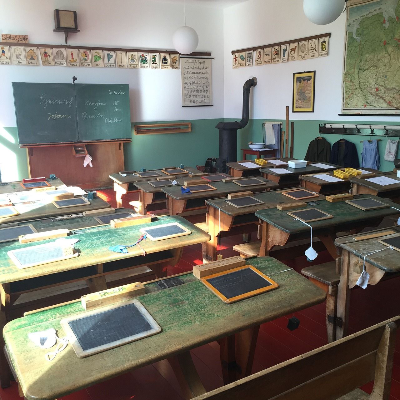 Old wooden school desks in a classroom