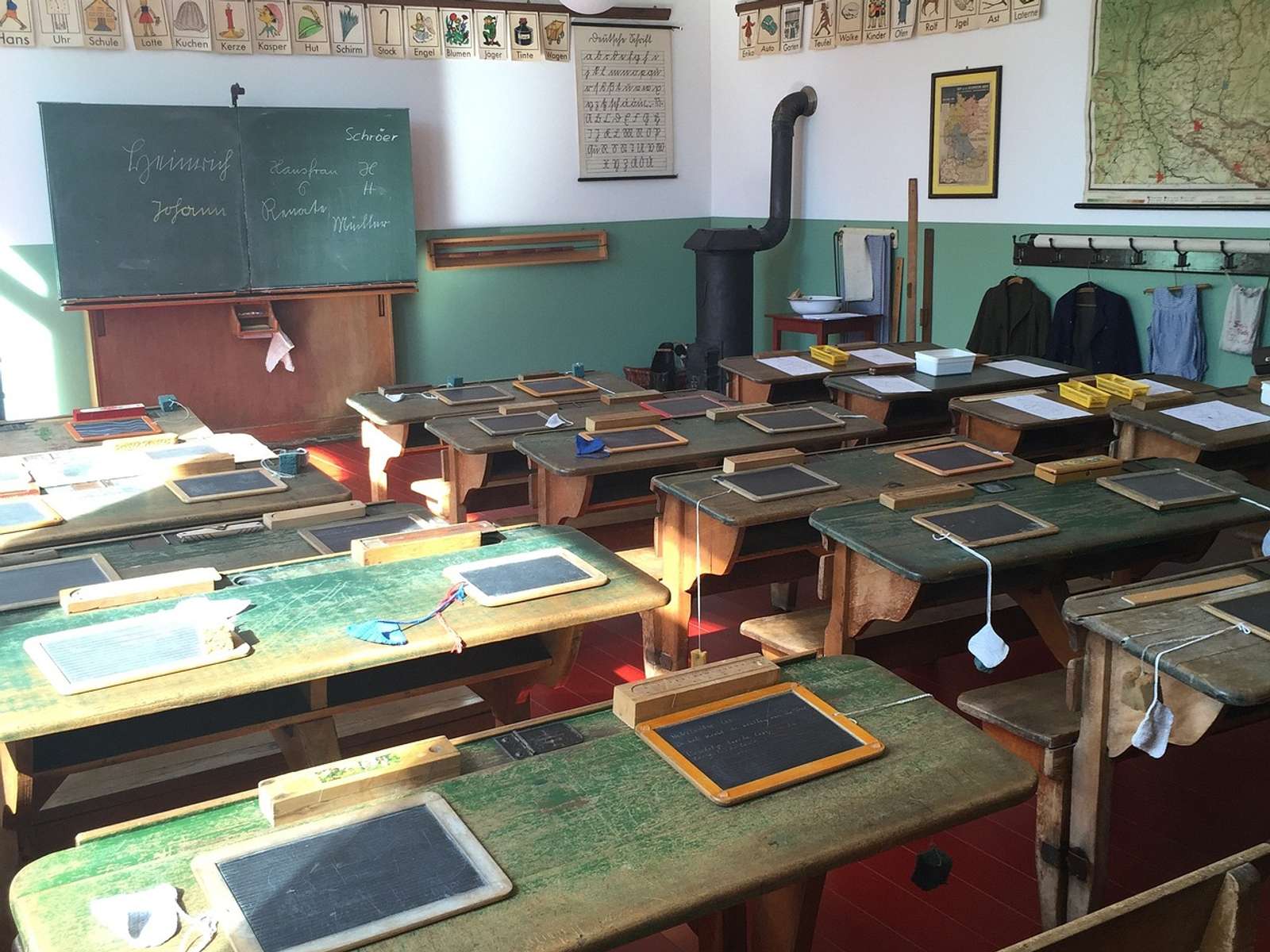 Old wooden school desks in a classroom
