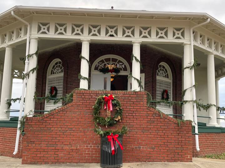The Chimborazo Park Round House decorated with green wreaths tied with red bows for the holidays, situated in Church Hill's historic Chimborazo Park.