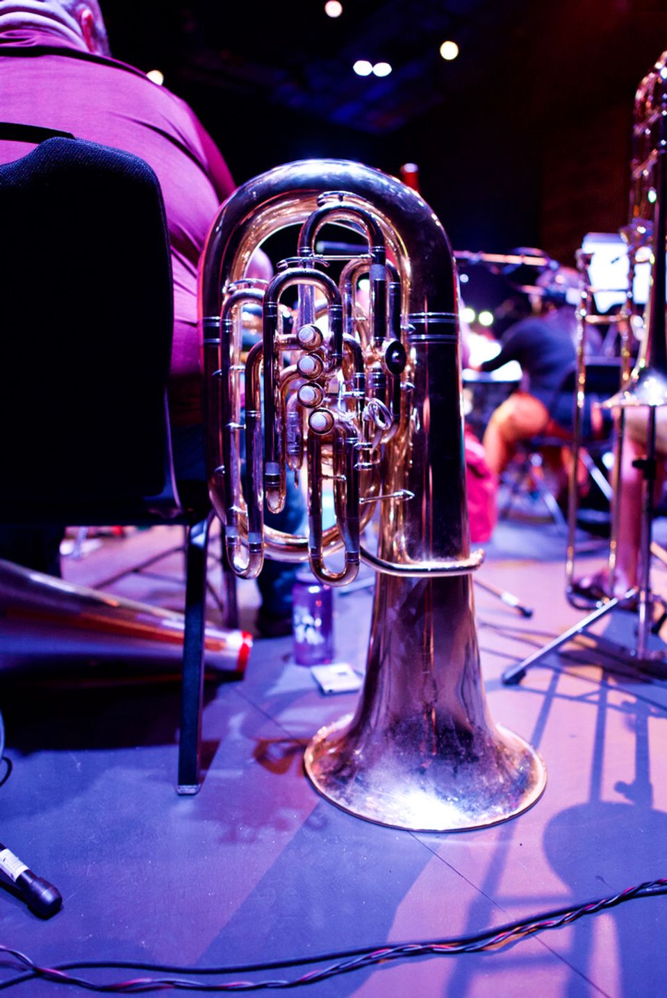 Brass instrument on floor.