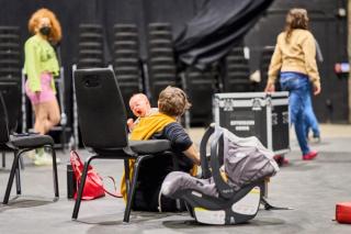 The director's baby yawns during rehearsal.