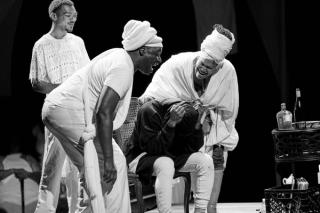 Demons tormenting a man.