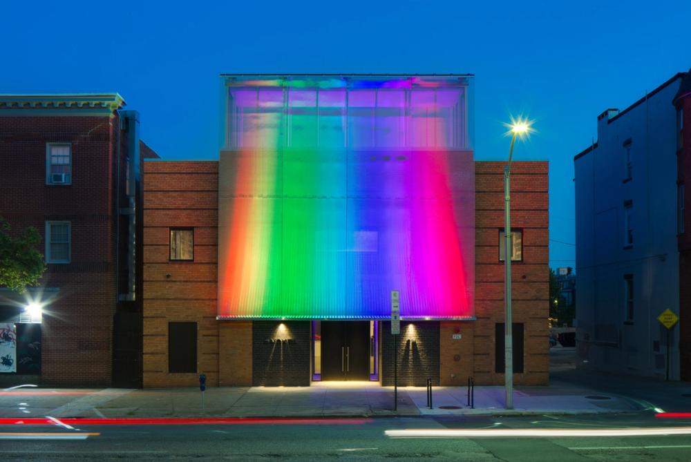 Voxel exterior at night with rainbow facade