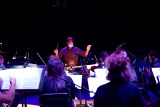 The conductor of the orchestra.