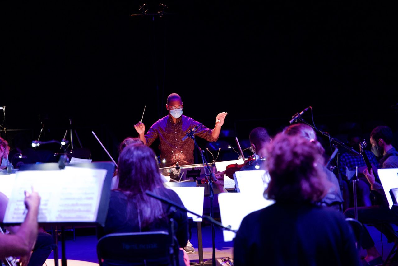 The conductor of the orchestra.