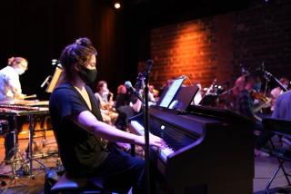 A pianist with Mind on Fire.