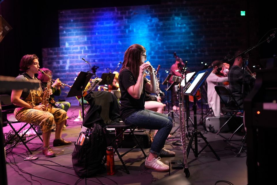 A flautist performs with Mind on Fire.