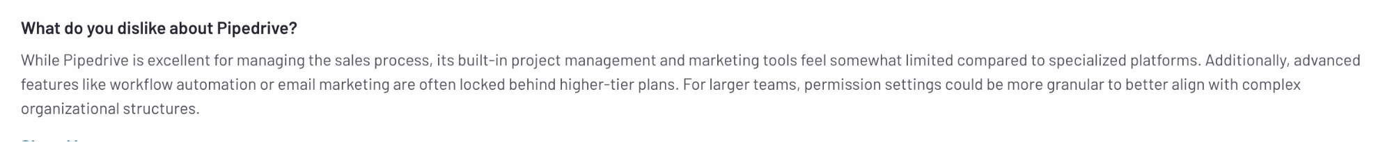 A user review explaining that Pipedrive’s project and marketing tools are limited and that features like automation are locked behind higher-tier plans.
