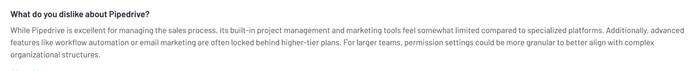A user review explaining that Pipedrive’s project and marketing tools are limited and that features like automation are locked behind higher-tier plans.