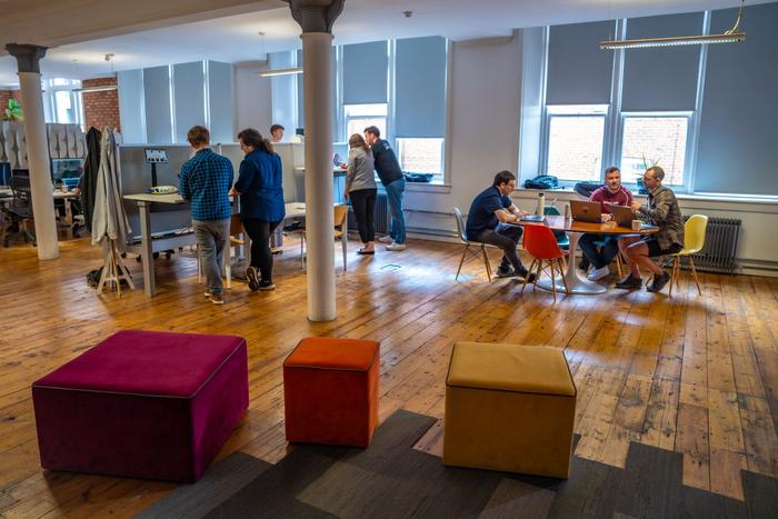 The team works at various desks in our office