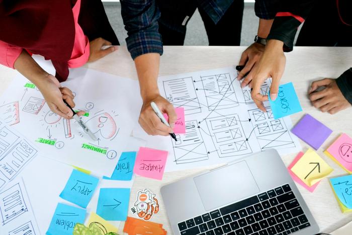 a group making notes on a table