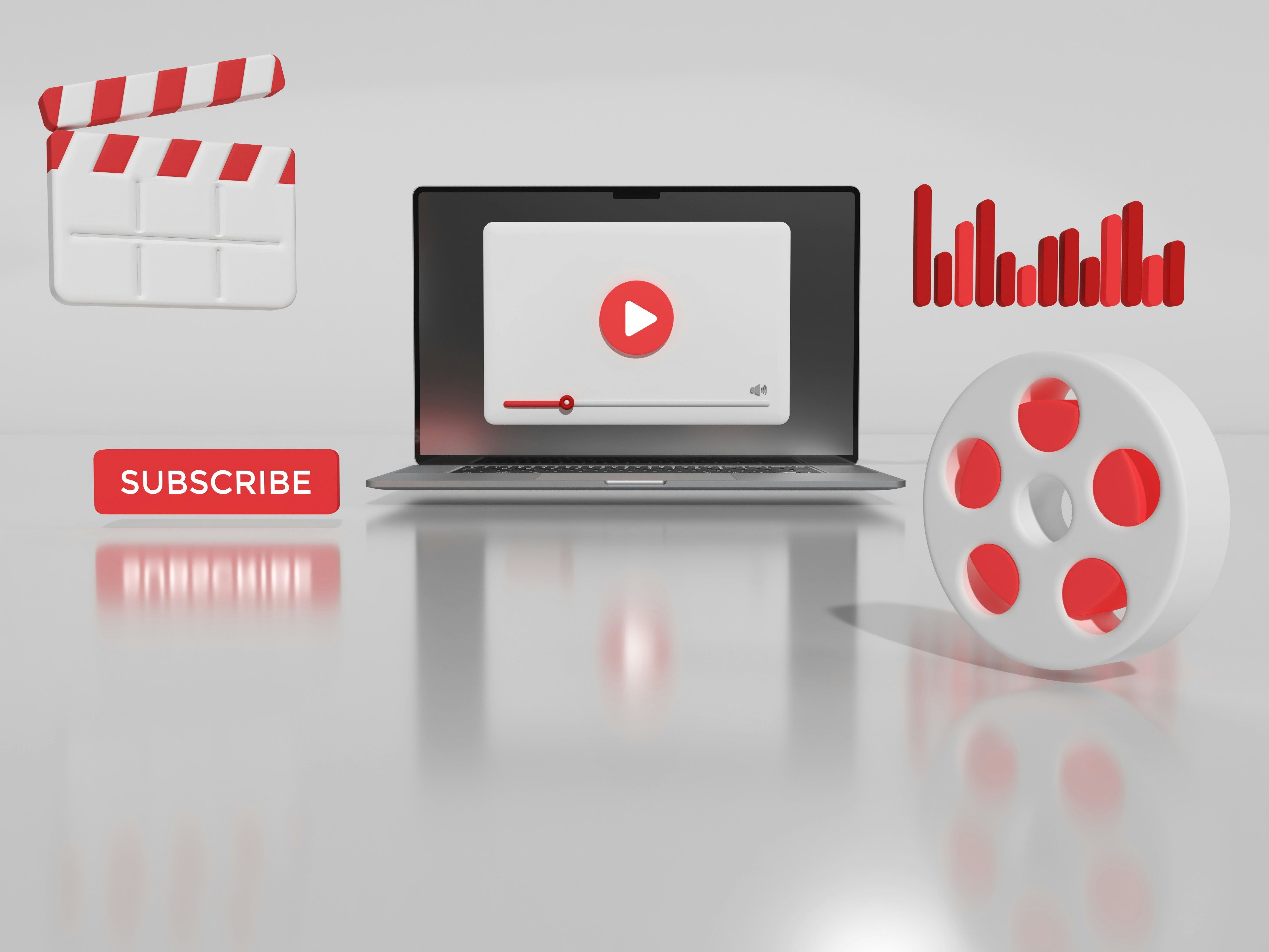 Laptop displaying a video player with film, subscribe, and analytics icons around it.