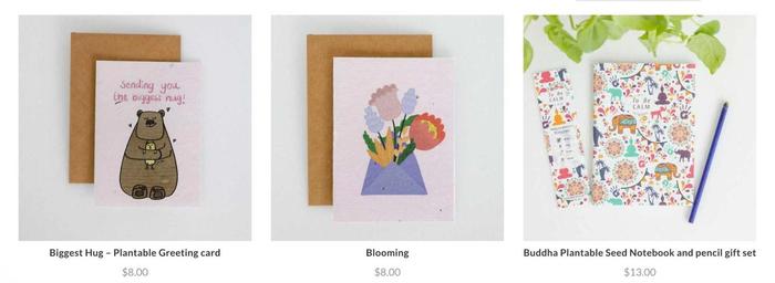 Three cards are sitting next to each other on a table.