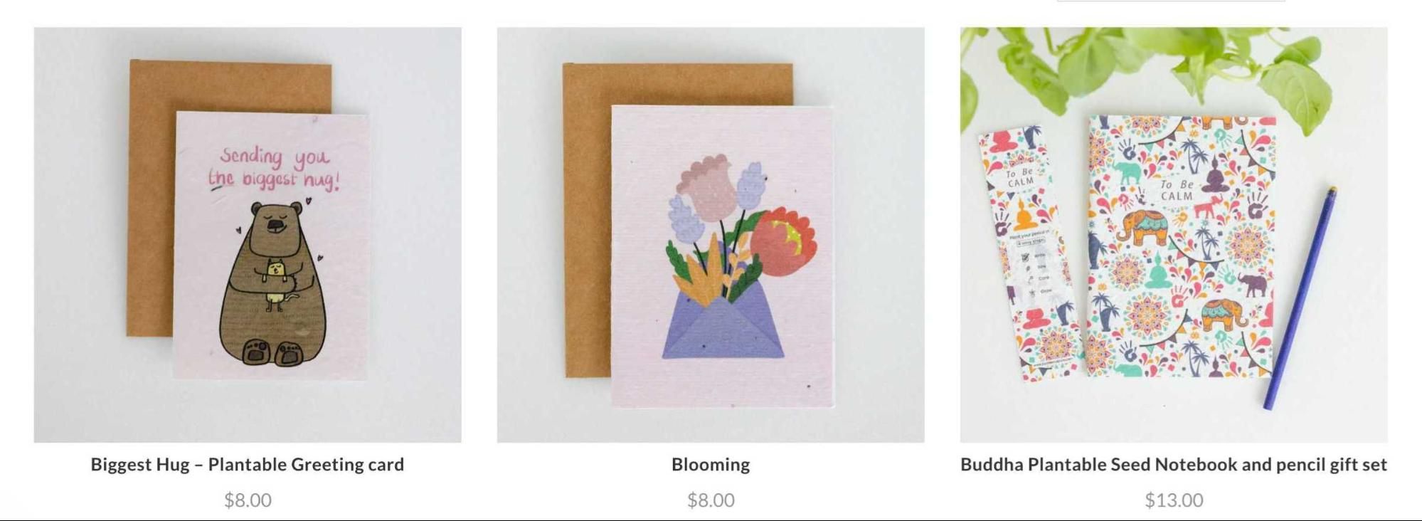 Three cards are sitting next to each other on a table.