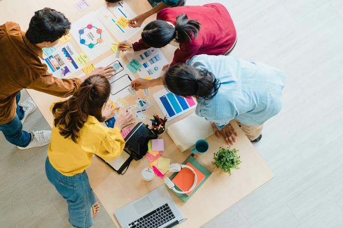 a group gathered over a desk