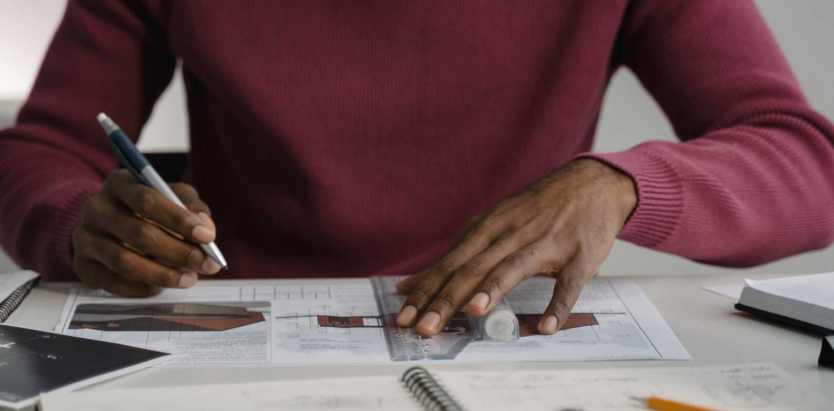 A man working on architectural documents