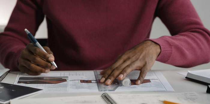 A man working on architectural documents