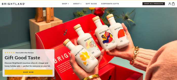 a woman is holding three bottles of brightland olive oil