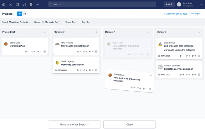 Project kanban view is displayed with a Project card being dragged towards the bottom of the page. Two buttons appear with the option to close the project or move it to another board