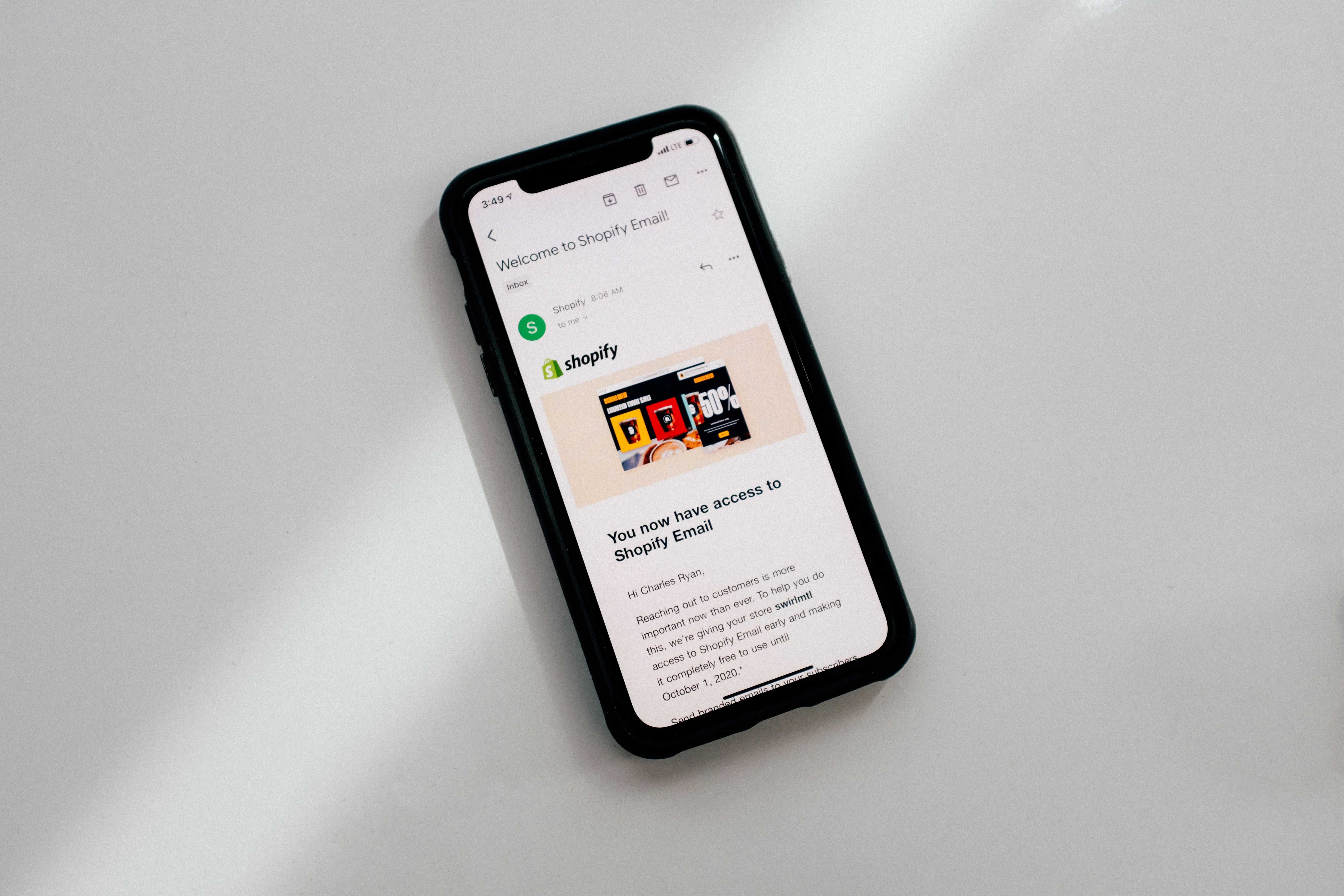 a phone showing a shopify email
