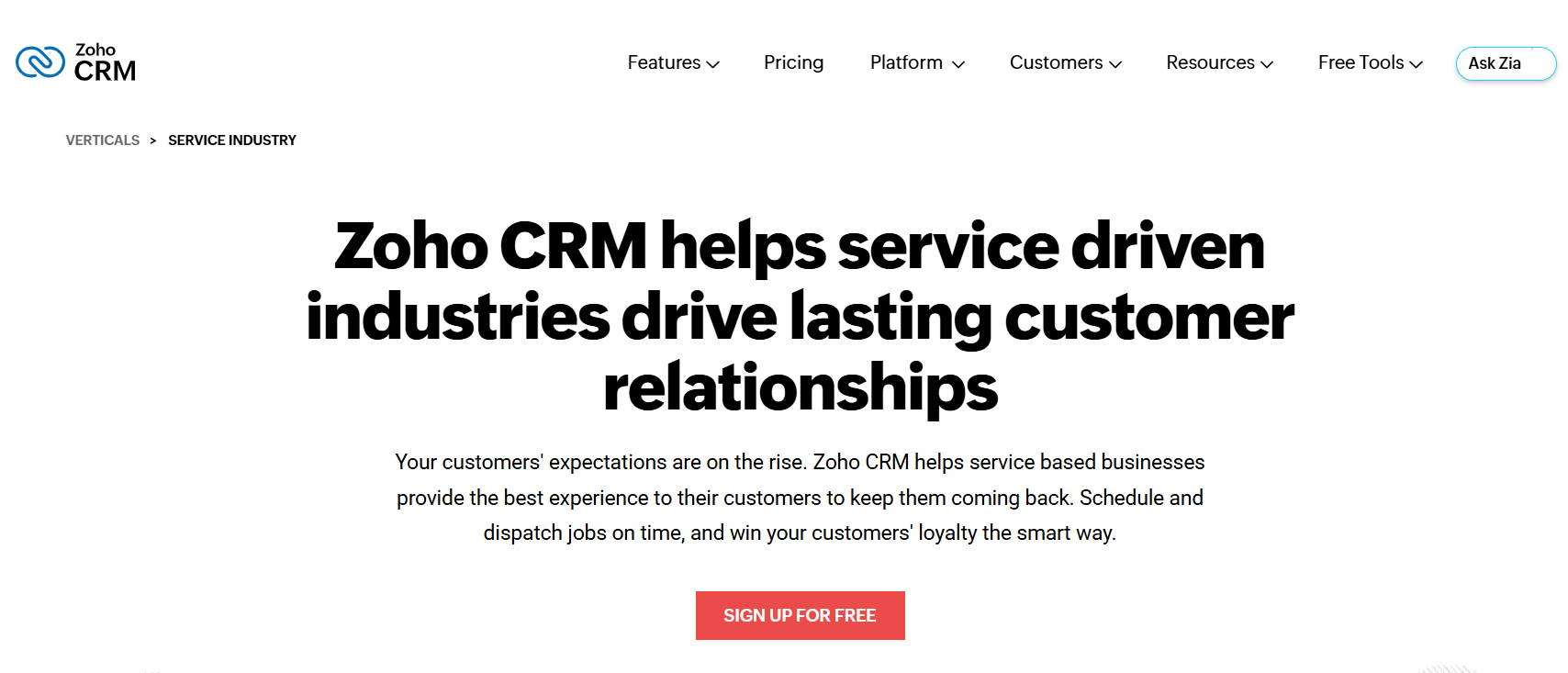 Zoho CRM webpage with logo, navigation menu, and prominent headline: "Zoho CRM helps service driven industries drive lasting customer relationships", above a "SIGN UP FOR FREE" button.