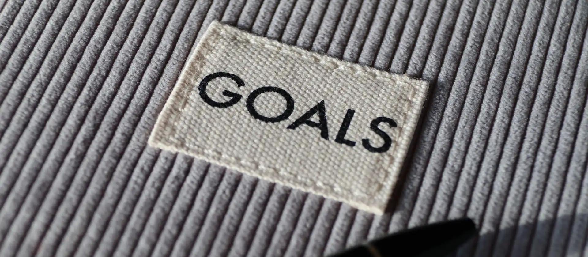 a close up of a label with the word goals written on it .